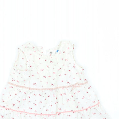 Close-up detail of Adams girls’ white floral a-line, size 3-6, months