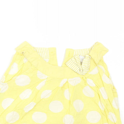 Close-up detail of Next girls’ yellow polka dot basic blouse, size 2-3, years