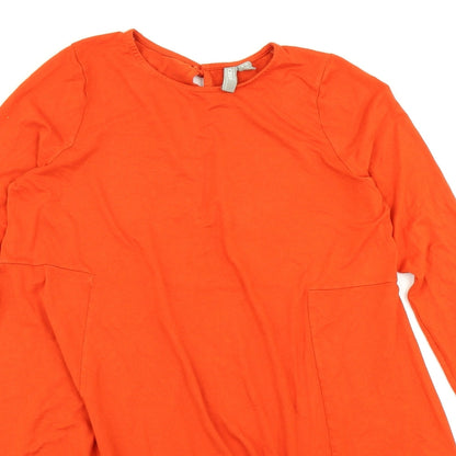 Close-up detail of ASOS women’s orange fit & flare, size UK 12