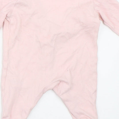 Brand and care label for Early Days girls’ pink babygrow one-piece size newborn