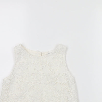 Close-up detail of H&M girls’ white basic tank, size 9, years