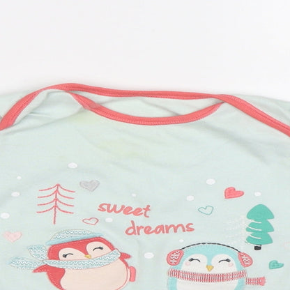 Close-up detail of Nutmeg girls’ green basic polo, size 2, years - penguins