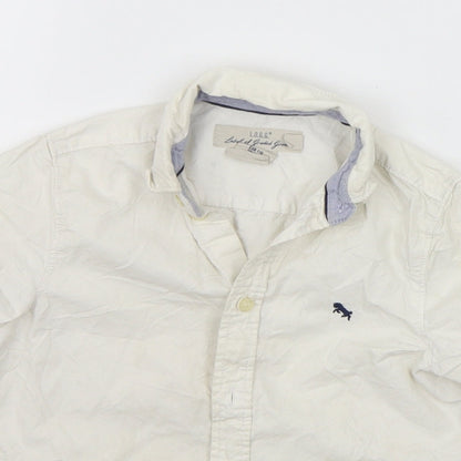 Close-up detail of H&M girls’ white houndstooth basic button-up, size 6-7, years