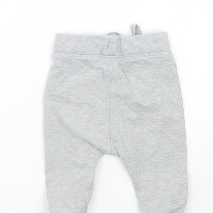 Brand and care label for Marks & Spencer Baby Grey sweatpants, size 6-9, Months