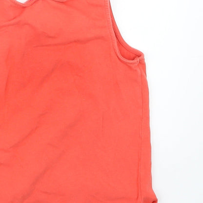 Brand and care label for Smiley World girls’ orange basic tank, size 6, years