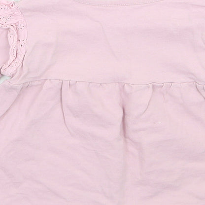 Brand and care label for Nutmeg girls’ purple basic t-shirt, size 12, months