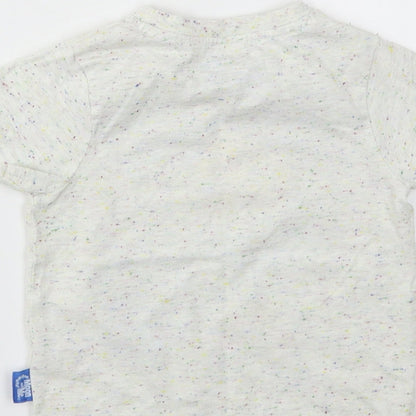 Brand and care label for Nutmeg girls’ ivory basic t-shirt, size 2, years