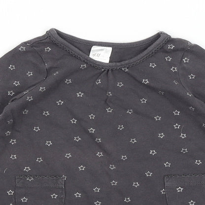 Close-up detail of H&M Baby Grey A-Line, size 9-12, Months