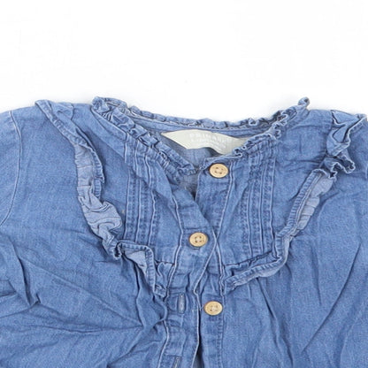 Close-up detail of Primark girls’ blue basic button-up, size 9-12, months