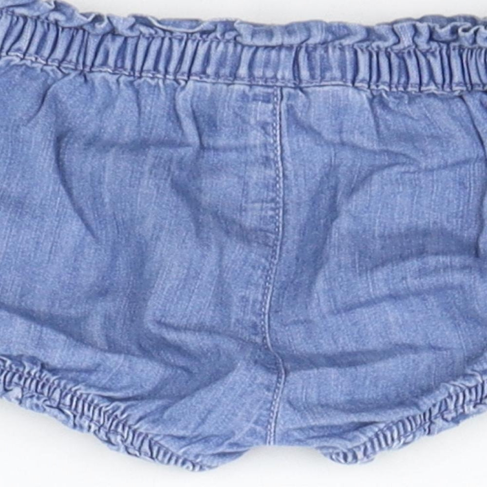 Brand and care label for Gap girls’ blue cropped trousers, size 9-12, months - elasticated waist
