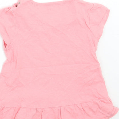 Brand and care label for Tu girls’ pink basic t-shirt, size 12, months
