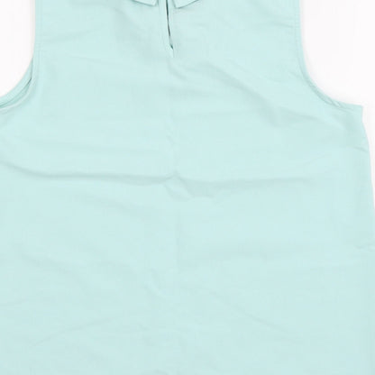 Brand and care label for Candy Cou girls’ blue basic blouse, size 12-13, years