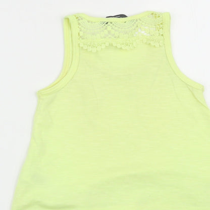 Brand and care label for Primark girls’ yellow basic tank, size 3-4, years