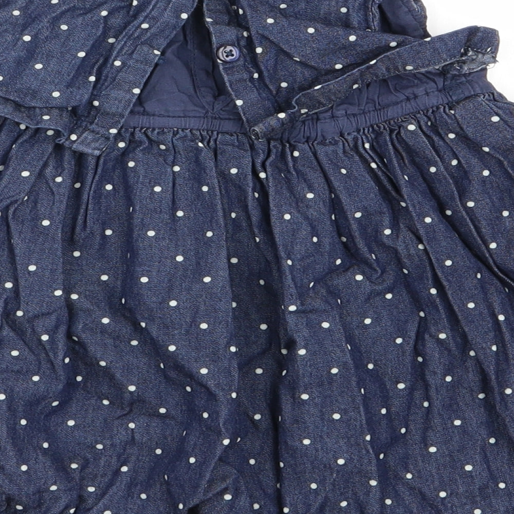 Brand and care label for baby club girls’ blue polka dot fit & flare, size 9-12, months