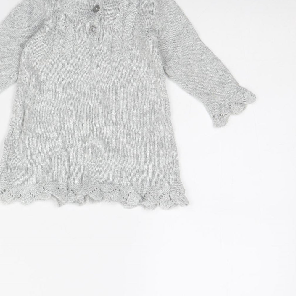 Brand and care label for F&F girls’ grey jumper dress, size 6-9, months