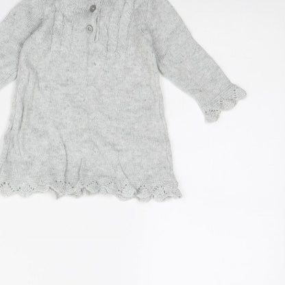 Brand and care label for F&F girls’ grey jumper dress, size 6-9, months