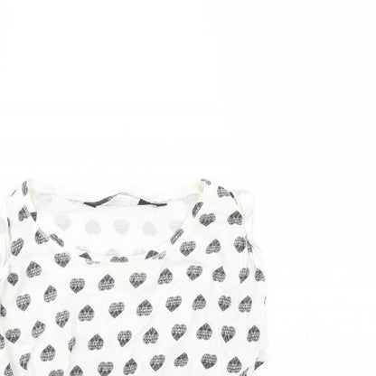 Close-up detail of New Look girls’ white spotted basic tank, size 9, years