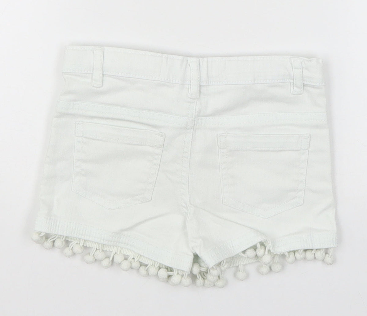 Back view of Denim Co girls’ white denim cut-off shorts, size 5-6, years - pom pom
