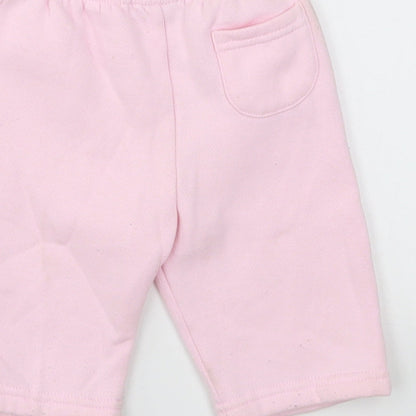 Brand and care label for Early Days girls’ pink capri leggings, size 0-3, months