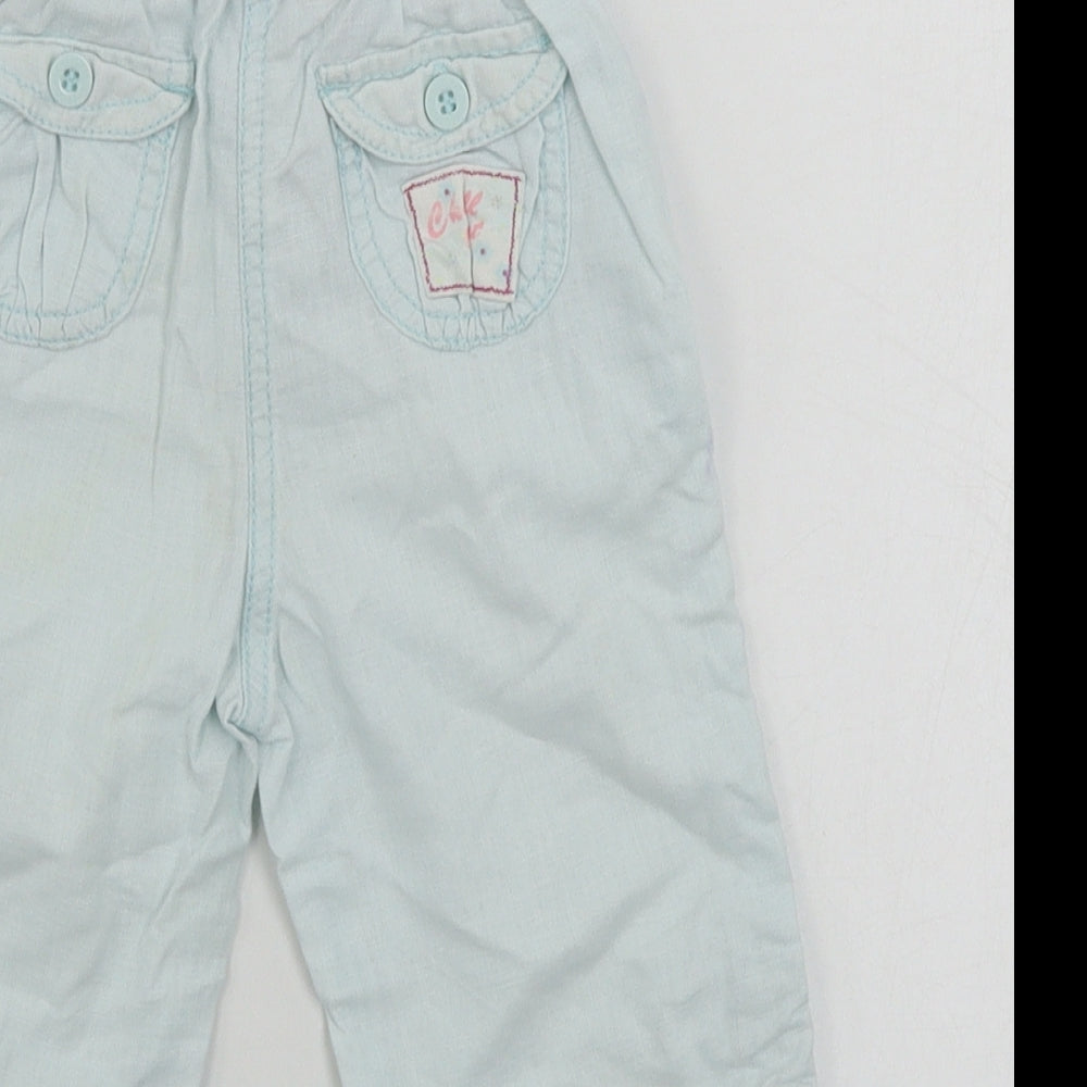 Brand and care label for Cherokee girls’ blue cargo trousers, size 12-18, months