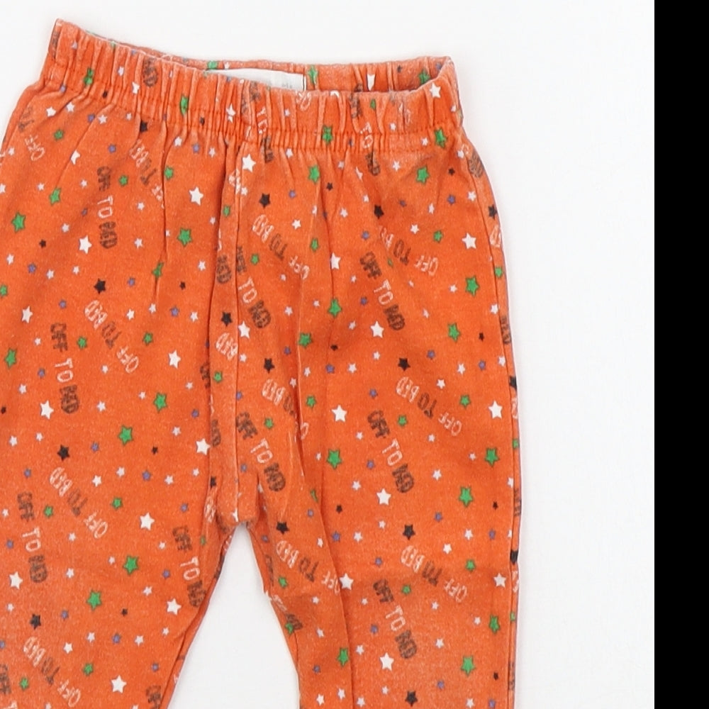 Close-up detail of Early Days girls’ orange geometric jogger leggings, size 6-9, months