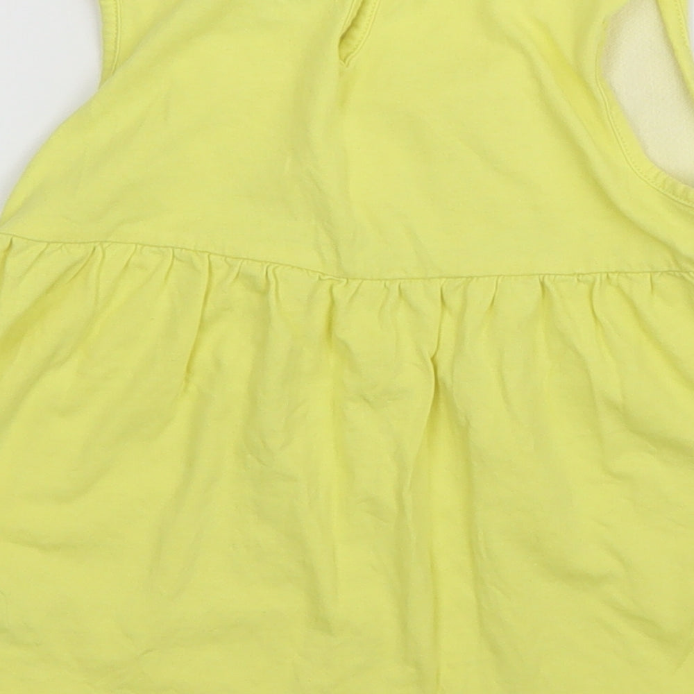 Brand and care label for Debenhams girls’ yellow basic blouse, size 3, years