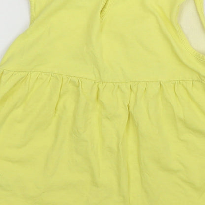 Brand and care label for Debenhams girls’ yellow basic blouse, size 3, years