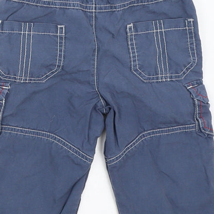 Brand and care label for Tu boys’ blue cargo trousers, size 6-9, months
