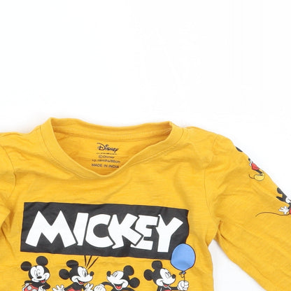 Close-up detail of Primark girls’ yellow basic t-shirt, size 12, months