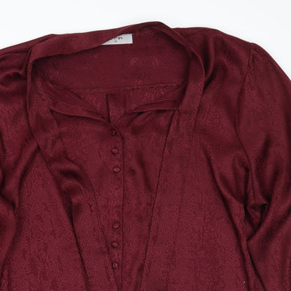 Close-up detail of Soon women’s red animal print basic button-up, size UK 18