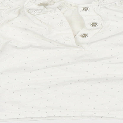 Brand and care label for Next girls’ white spotted basic blouse, size 3-6, months