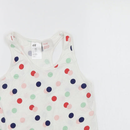 Close-up detail of H&M girls’ white polka dot basic tank, size 11-12, years