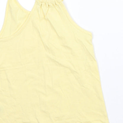 Brand and care label for Nutmeg girls’ yellow basic tank, size 6-7, years