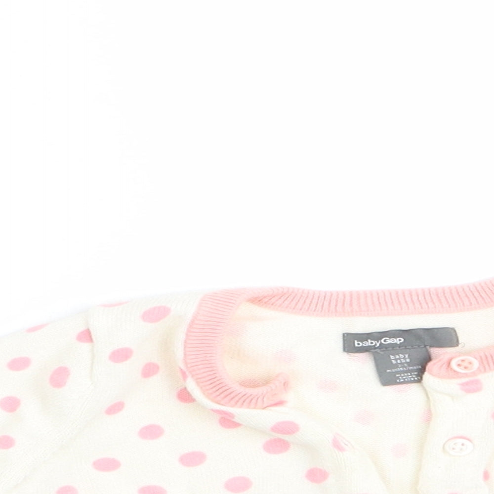 Close-up detail of Gap girls’ pink polka dot cardigan jumper, size 3-6, months