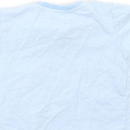 Brand and care label for Tu boys’ blue basic t-shirt, size 9-12, months