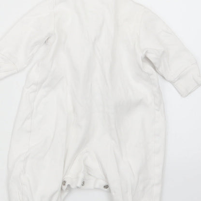 Brand and care label for Next girls’ white coverall outfit/set, size 0-3, months