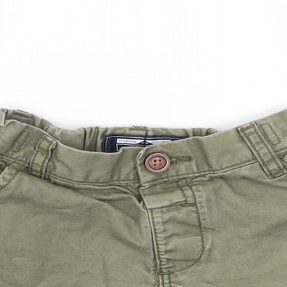 Close-up detail of Next girls’ green capri trousers, size 9-12, months