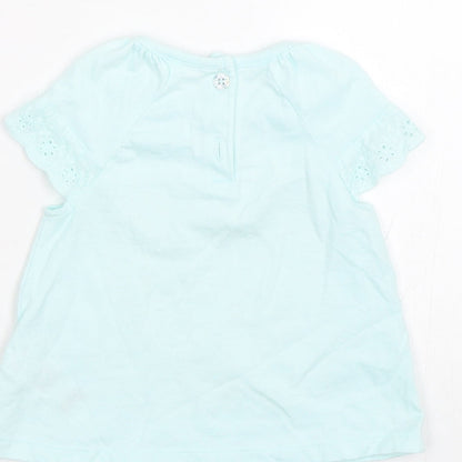 Brand and care label for F&F girls’ blue basic t-shirt, size 3-6, months