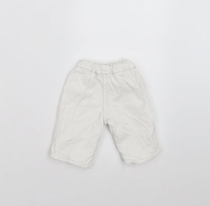 Back view of BHS girls’ white trousers size newborn - embroidered detail