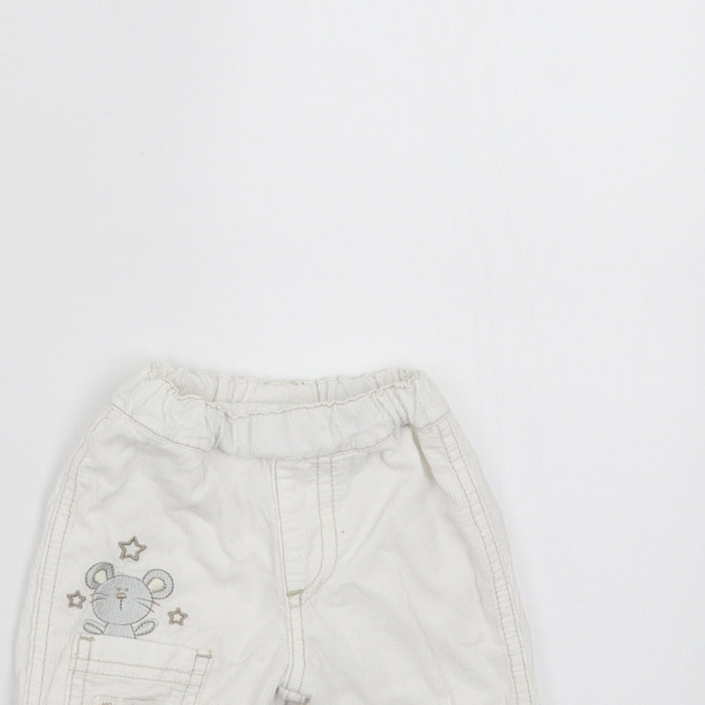 Close-up detail of BHS girls’ white trousers size newborn - embroidered detail