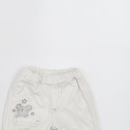 Close-up detail of BHS girls’ white trousers size newborn - embroidered detail