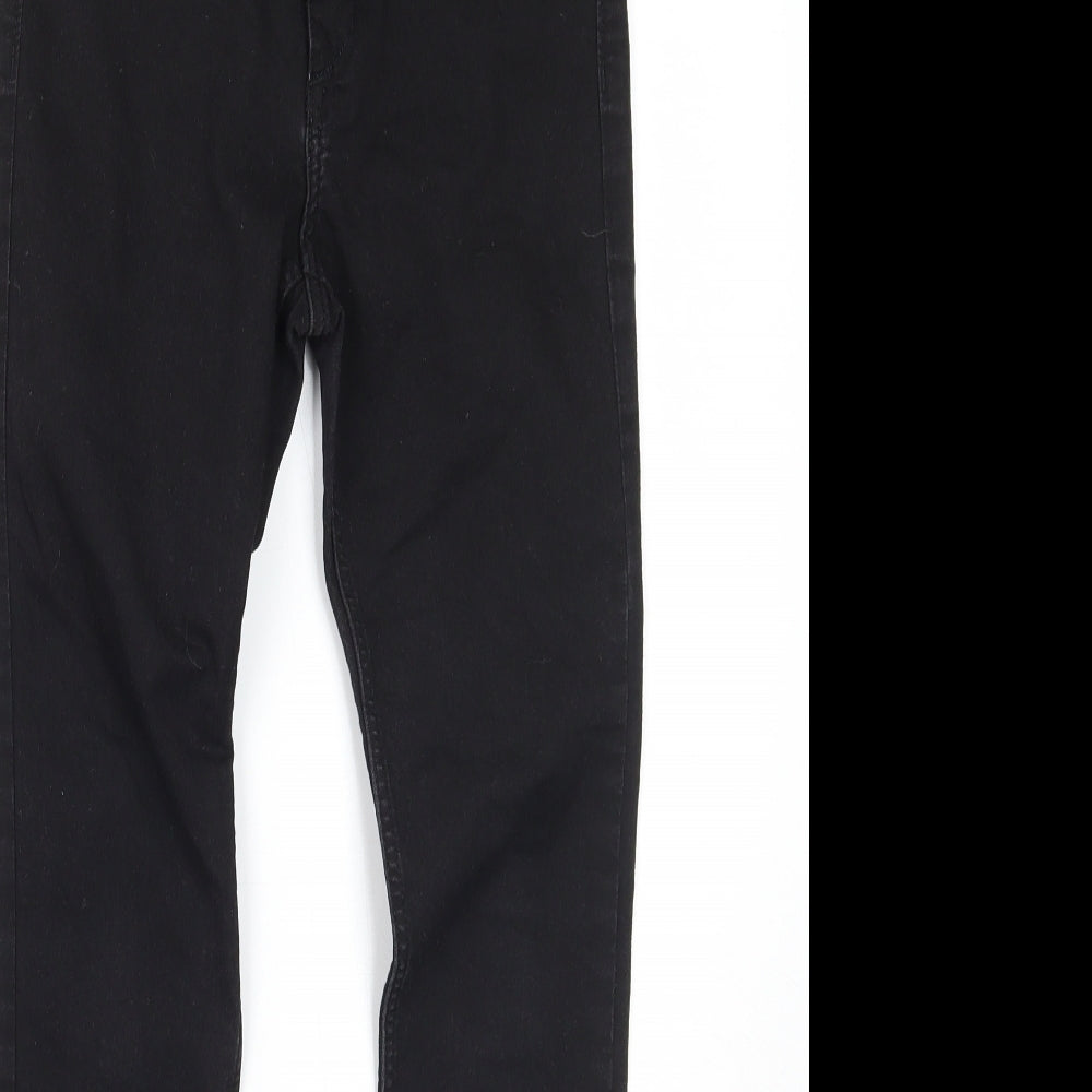 Close-up detail of & denim girls’ black skinny jeans, size 10-11, years