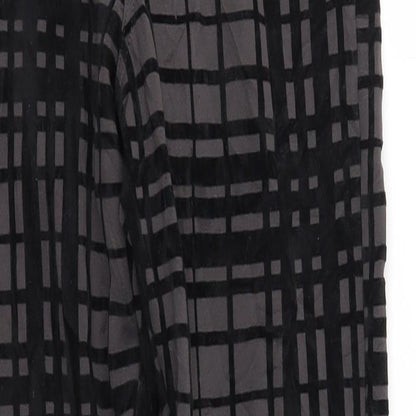 Close-up detail of ASOS women’s black trousers, size UK 6, 29-inch leg