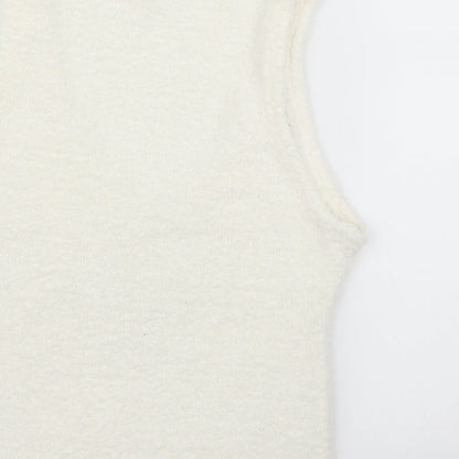 Brand and care label for George girls’ ivory basic tank, size 13, years