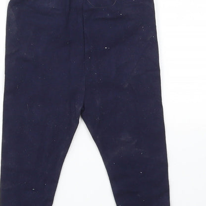 Brand and care label for Gap girls’ blue capri leggings, size 6-9, months