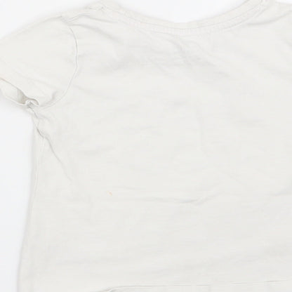 Brand and care label for Nutmeg girls’ white basic t-shirt, size 2-3, years