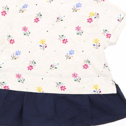 Brand and care label for Gap girls’ beige floral basic t-shirt, size 2, years
