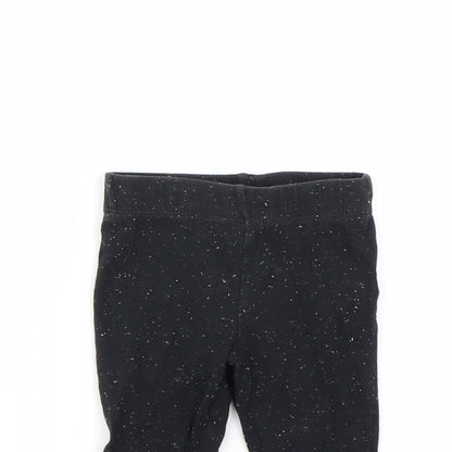 Close-up detail of F&F girls’ black spotted capri leggings, size 3-6, months