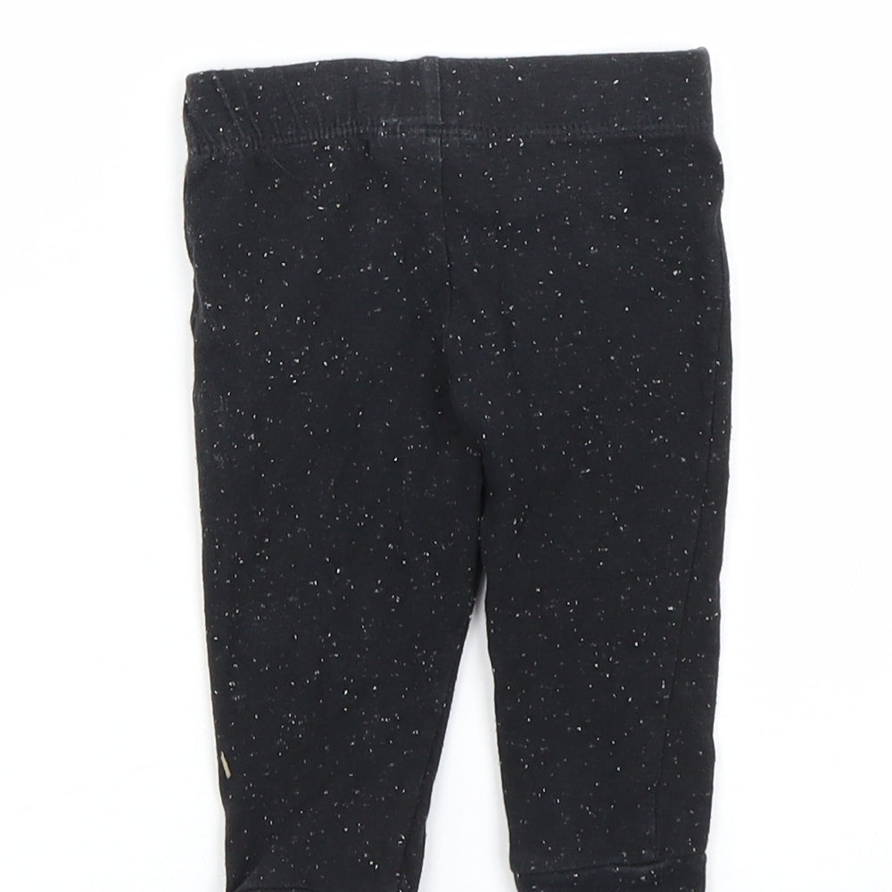 Brand and care label for F&F girls’ black spotted capri leggings, size 3-6, months