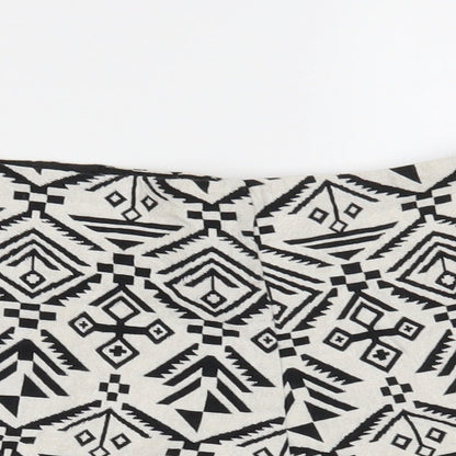 Close-up detail of Miss Selfridge women’s white geometric hot pants shorts, size UK 10